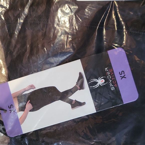 See Other Listing For This Item.NWT SPYDER active leggings, black print, pockets - Picture 11 of 11